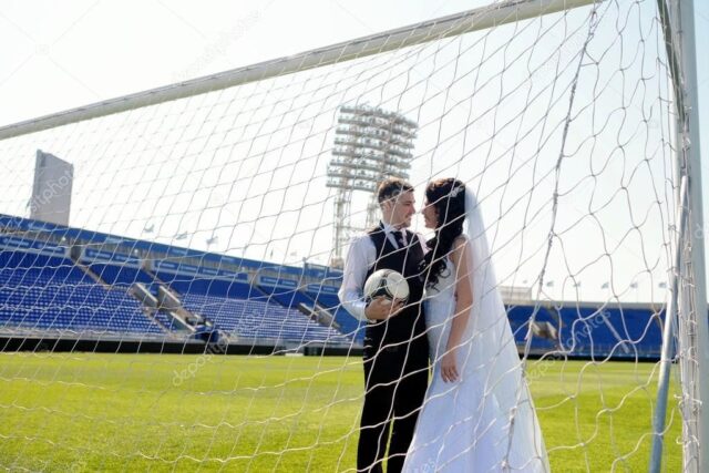 Depositphotos 104840306 stock photo wedding couple on football stadium